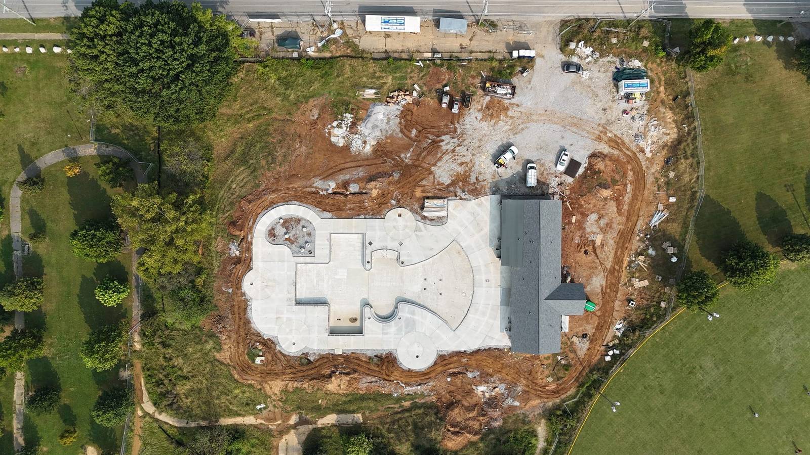 Aerial of the Camp Taylor pool shell, deck, and slide tower during construction