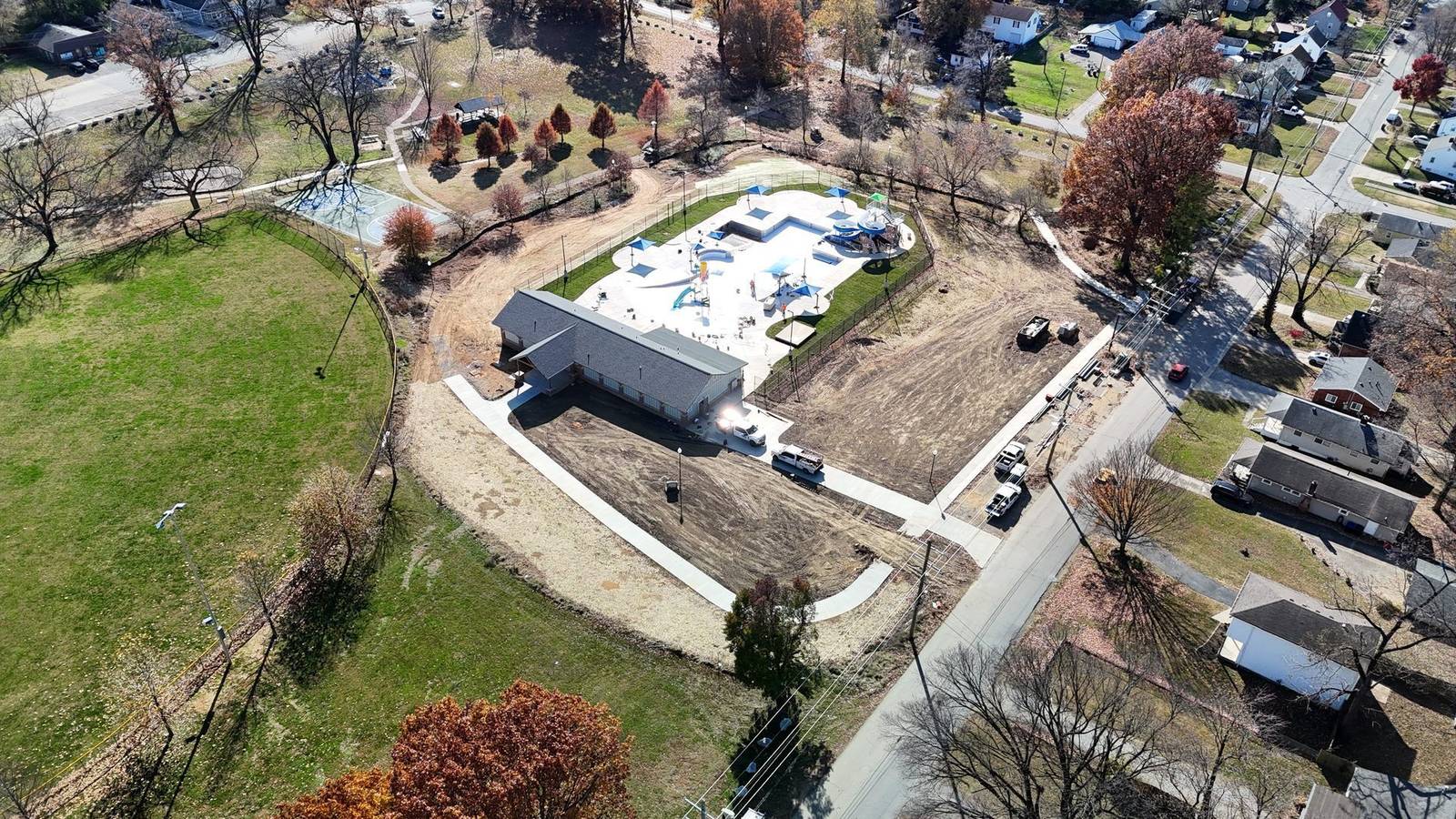 Aerial of the Camp Taylor waterpark and pool house beside the surrounding park