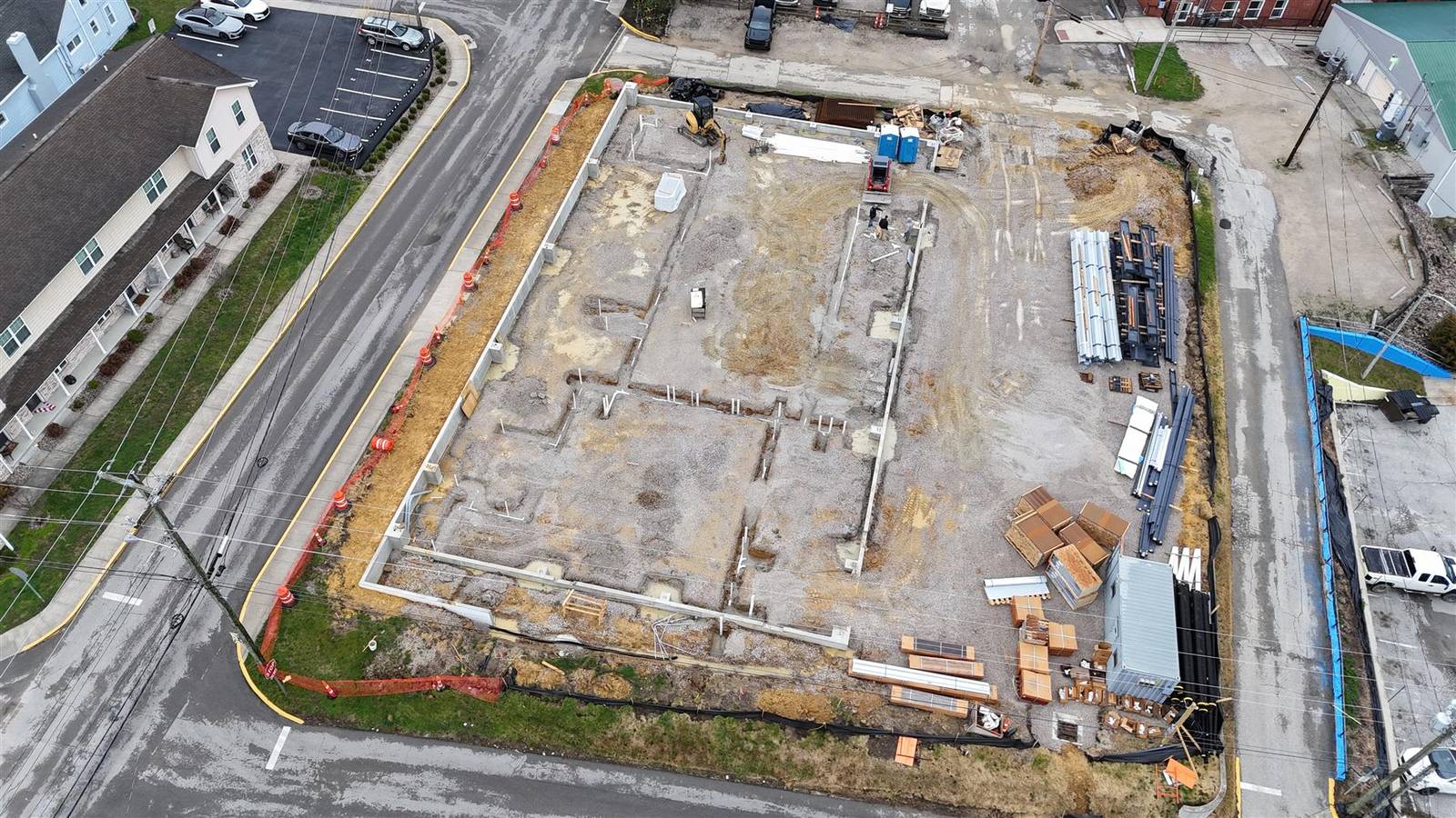 Closer aerial of the steel frame and concrete slab, March 2026