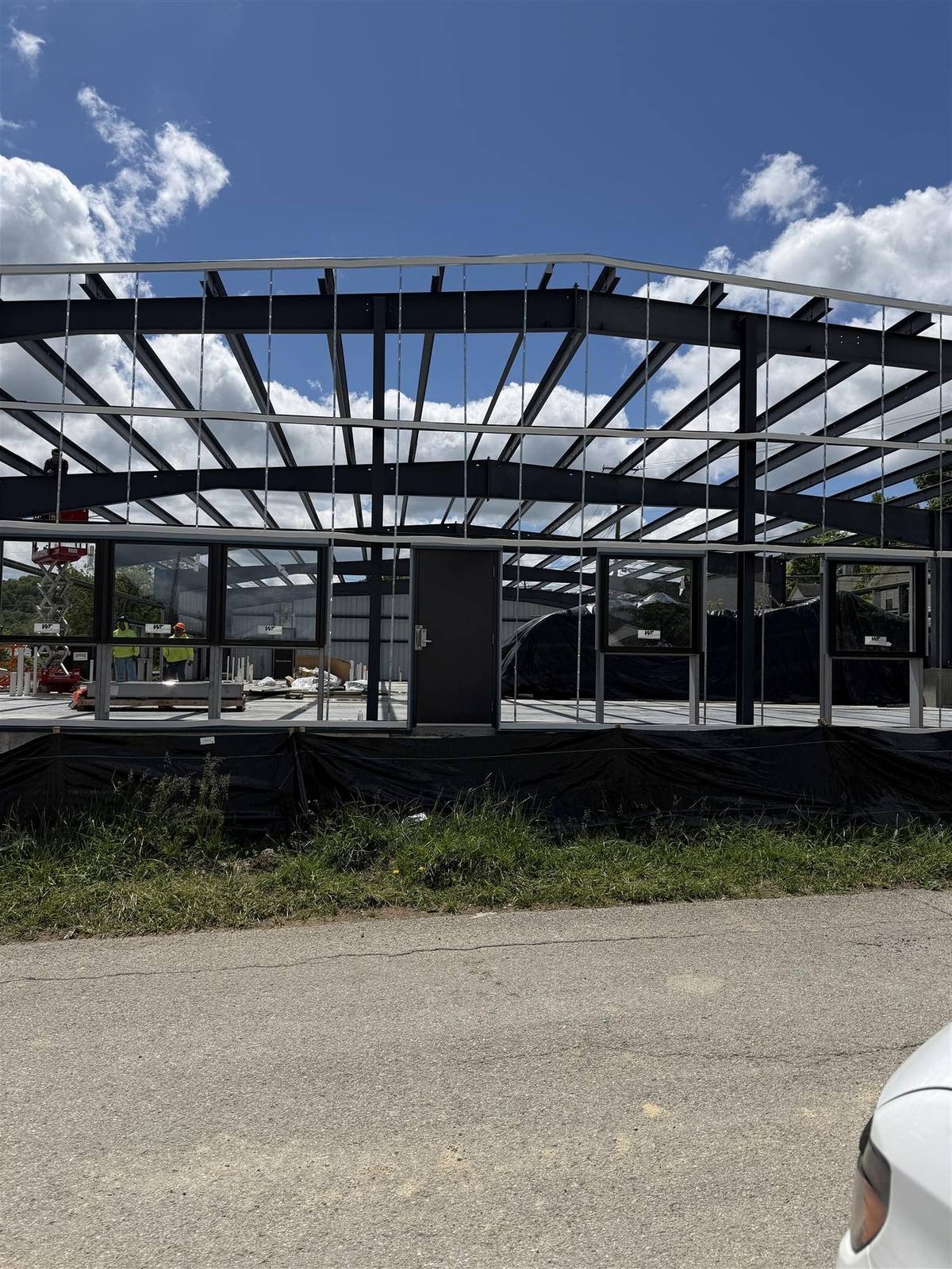 Roof panels on the pre-engineered metal building, April 2026